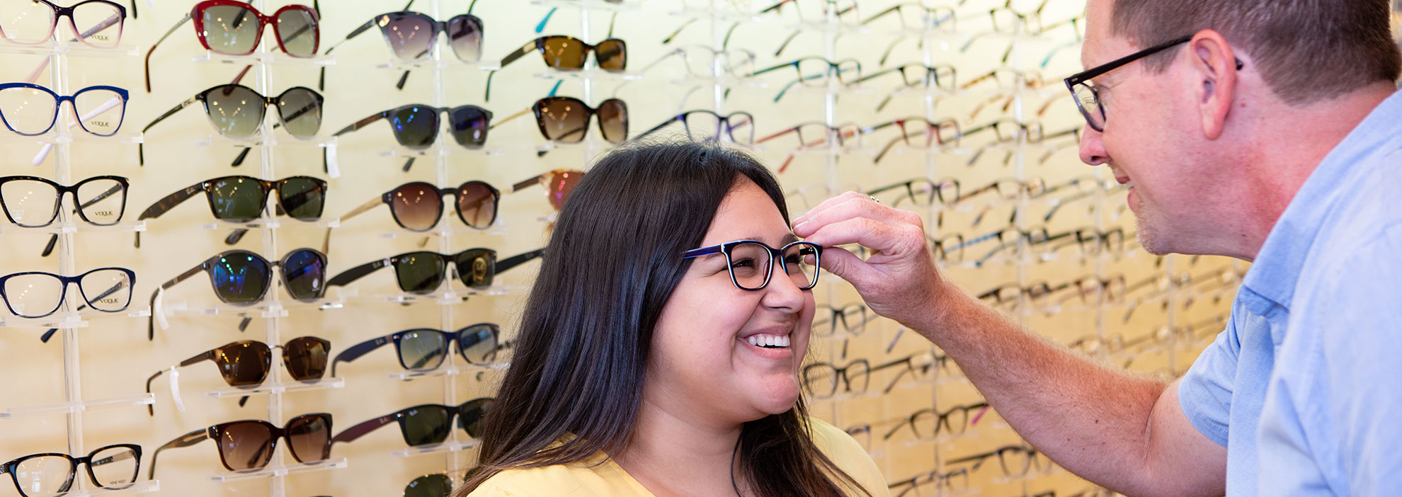 trying on glasses