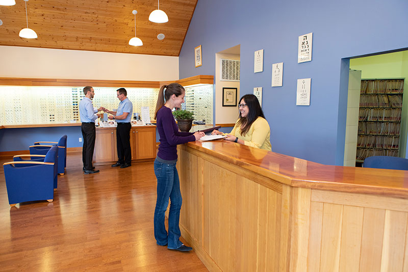 White Salmon Eyecare Front Desk Patient receiving paperwork