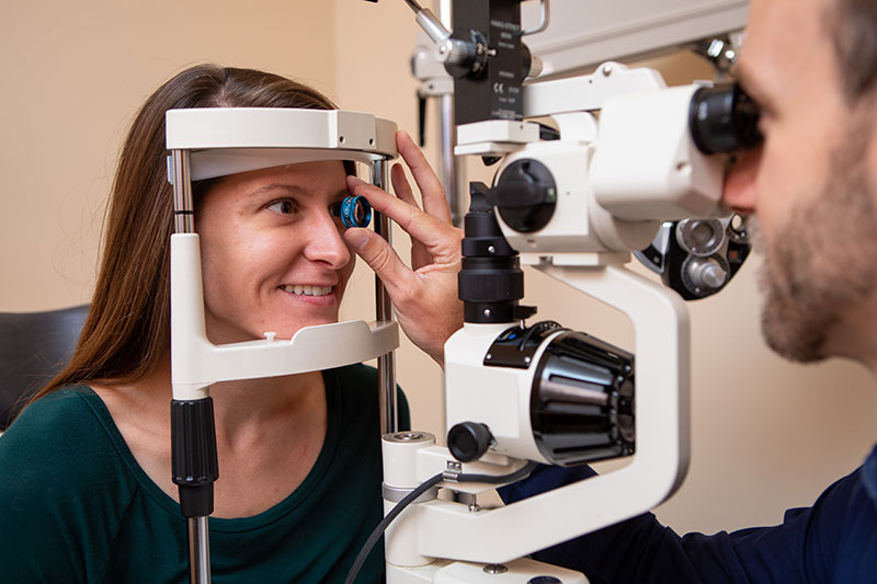 Dr. Alex performing an eye exam